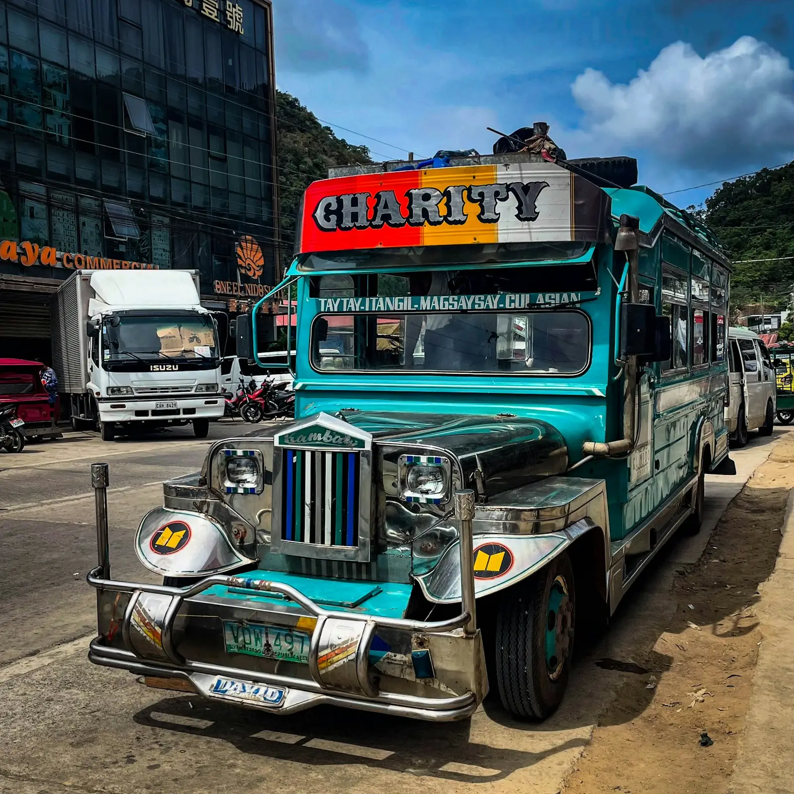 Colorful jeepney parked on a street in El Nido, a common cheap local transport option