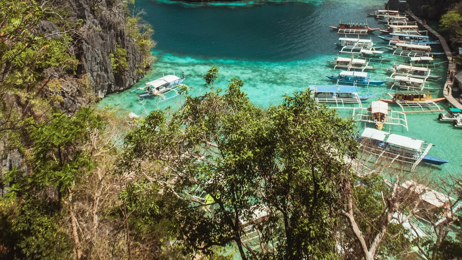 The classic viewpoint above Kayangan Lake, Coron, Palawan, with bangka boats moored below
