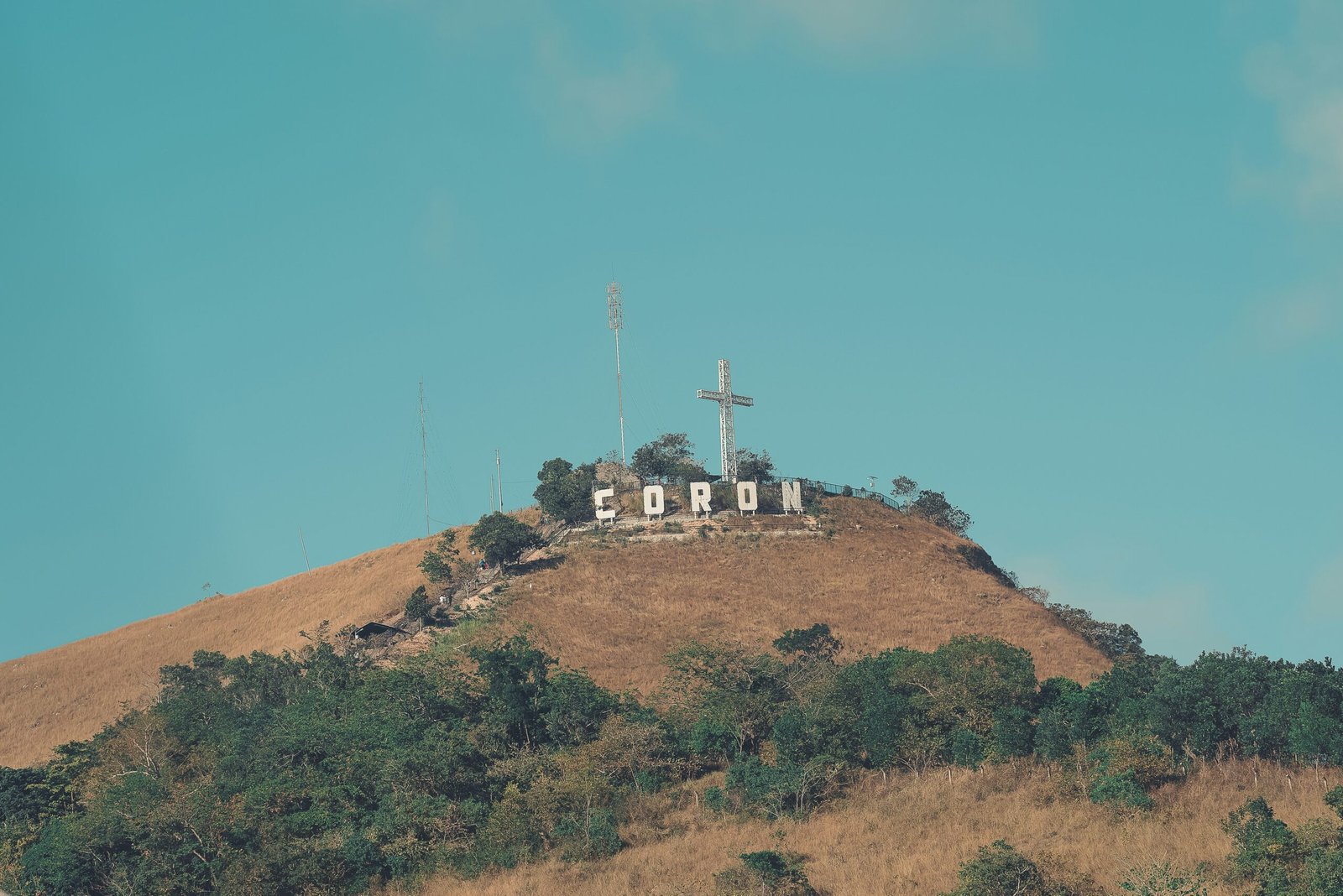 The white summit cross on Mount Tapyas above Coron Town, Palawan, Philippines